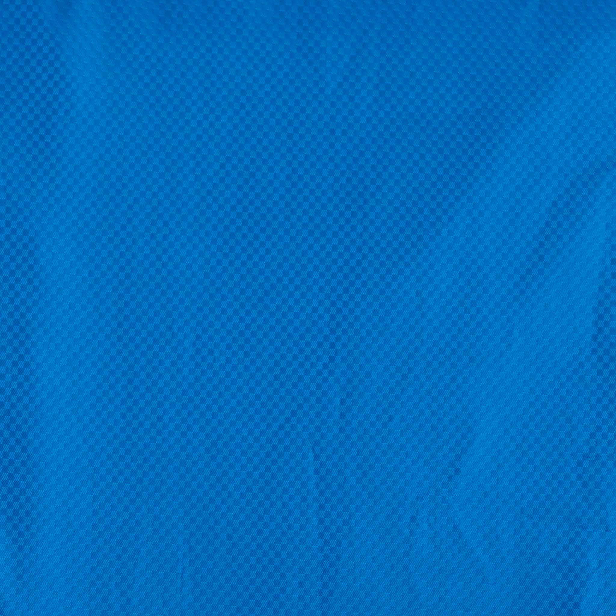 Närbild av blått strukturerat tyg, All-weather jacket Monaco v24, fotboll Match & Training kläder